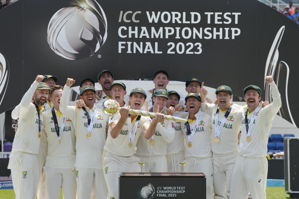 Australian team holding the World Test Championship trophy in 2023 Australian team celebrate after Winning World Test Championship 2023 final at The Oval